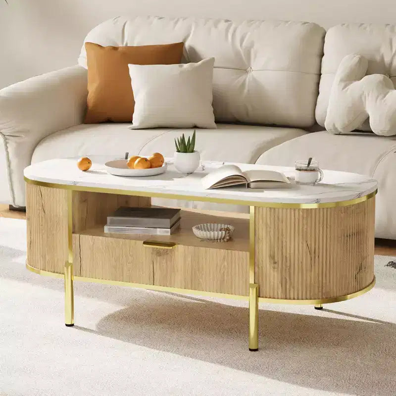 Table basse cannelée moderne, ovale 122 cm avec tiroir, plateau en faux marbre et accents métalliques dorés